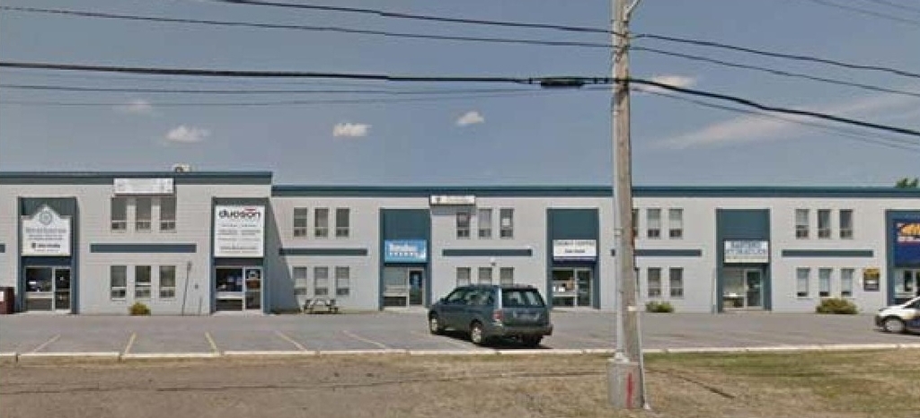 Rendering of building from page 3 of the file '2021-11-15 Design Brief D07-12-21-0114'